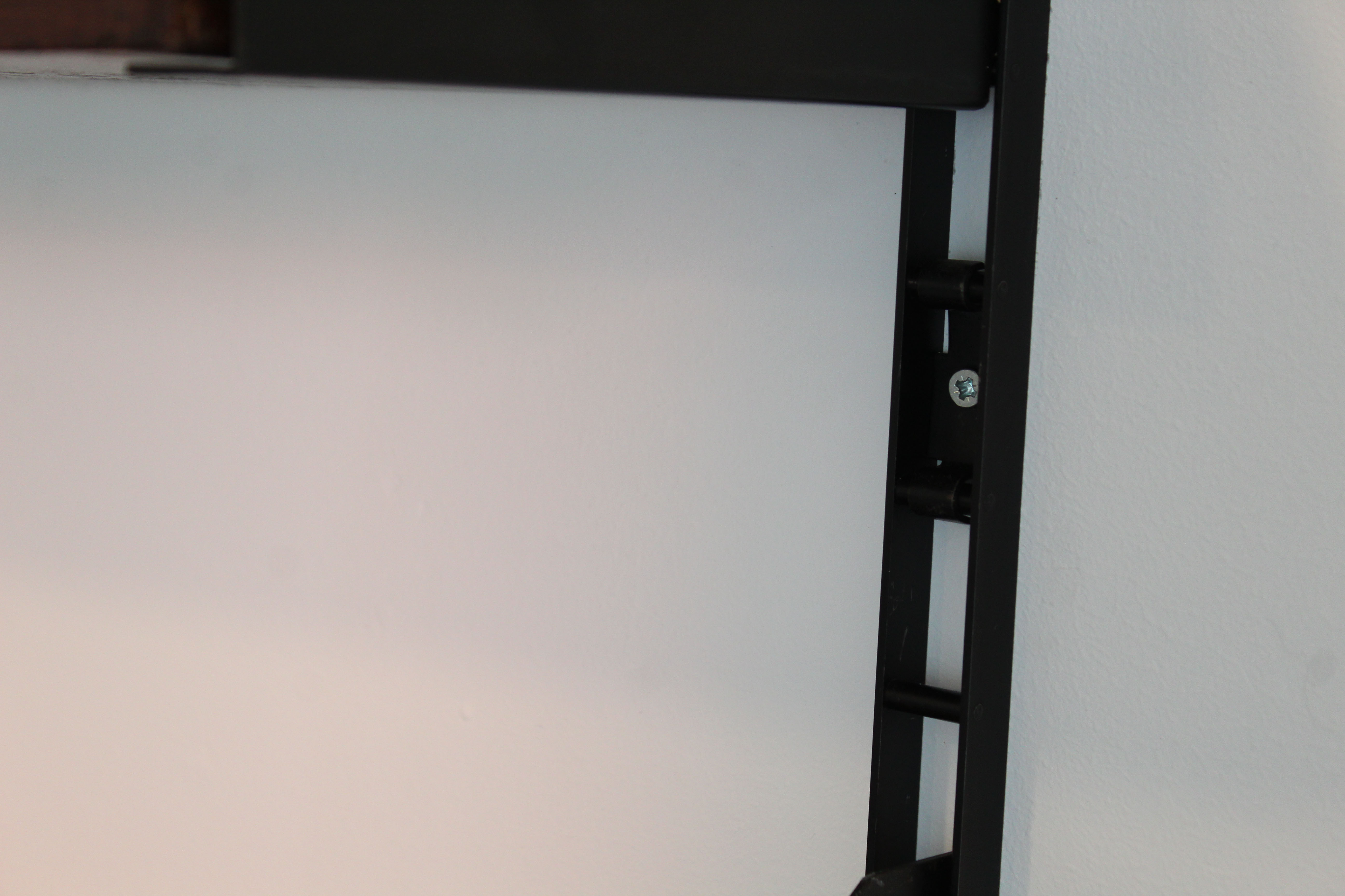 Shelves in rosewood and black lacquered metal from the 50s