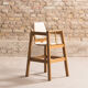 Children's high chair in solid tinted beech, seat and back in imitation cream leather, certification