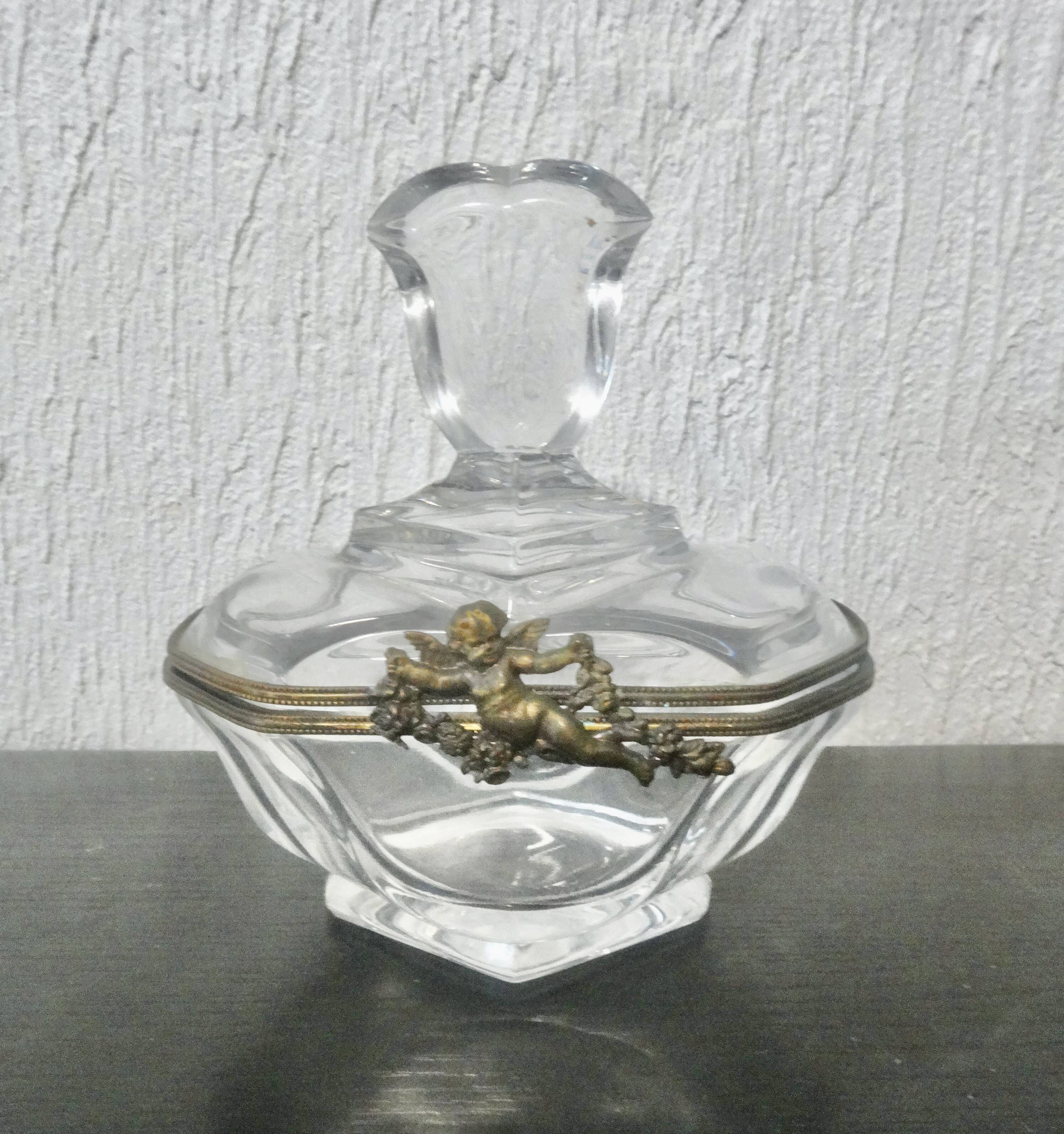 glass jewelry box with brass cherub decoration
