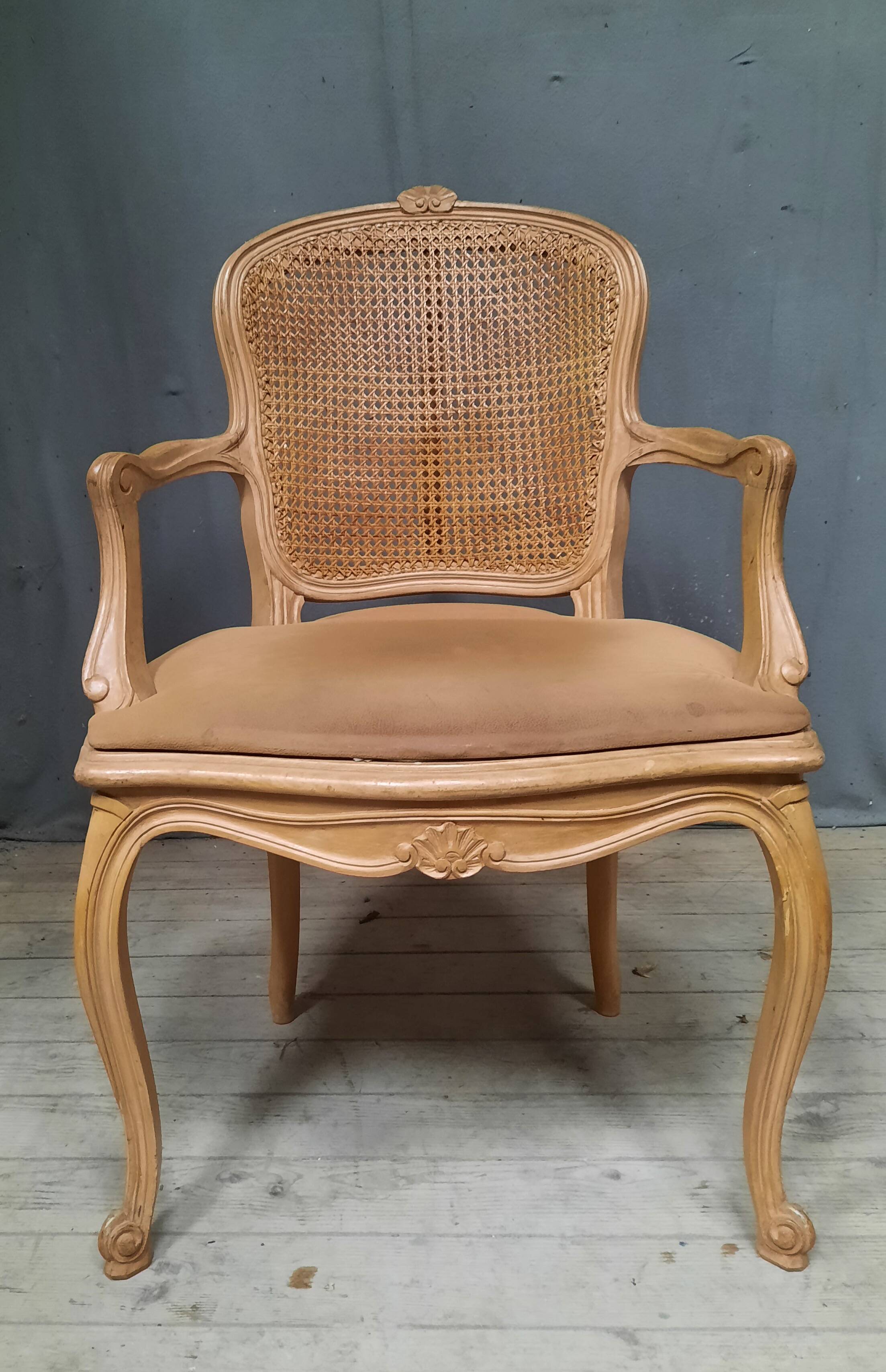 Louis XVI style caned armchair