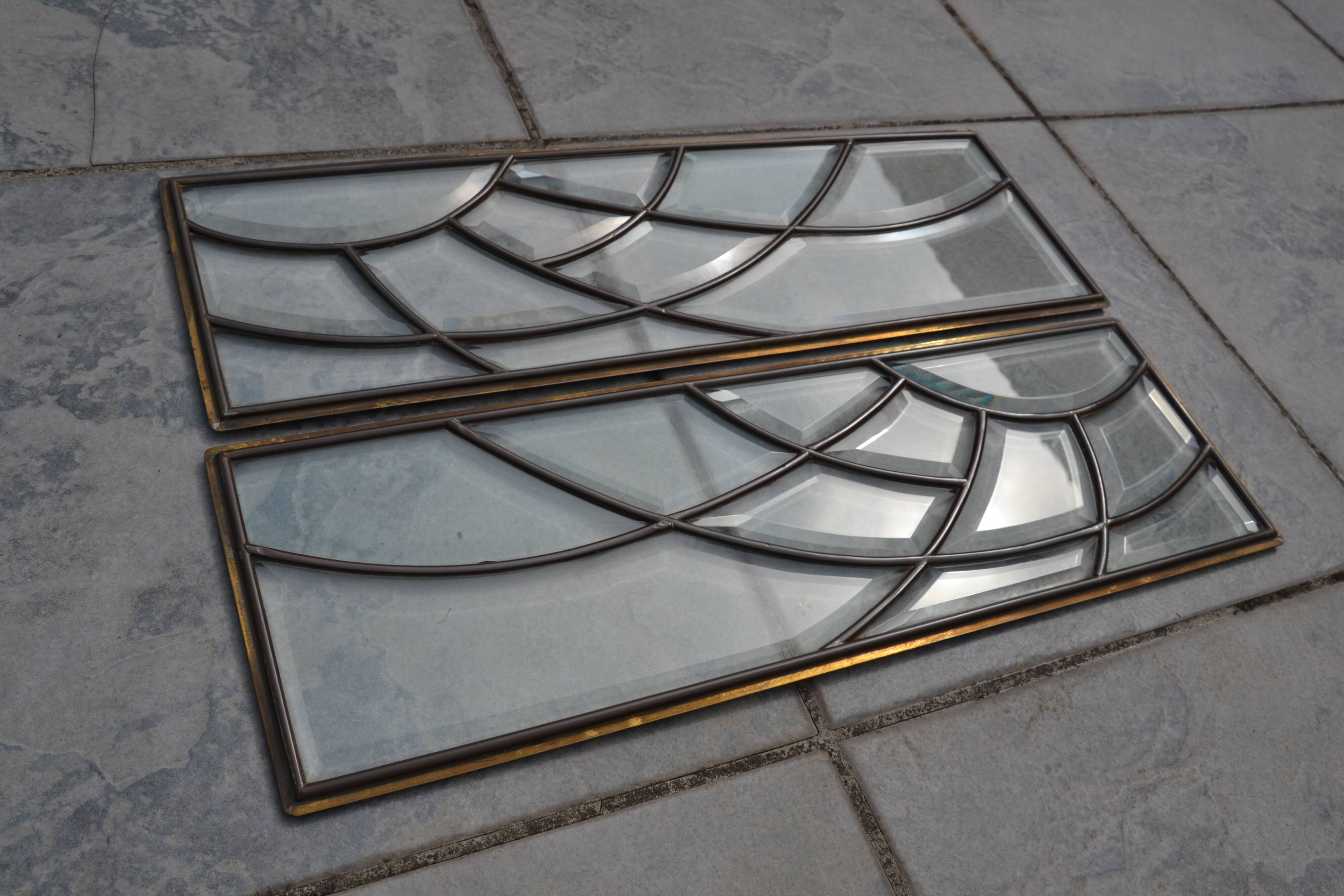 Deux vitraux en verre biseauté et laiton