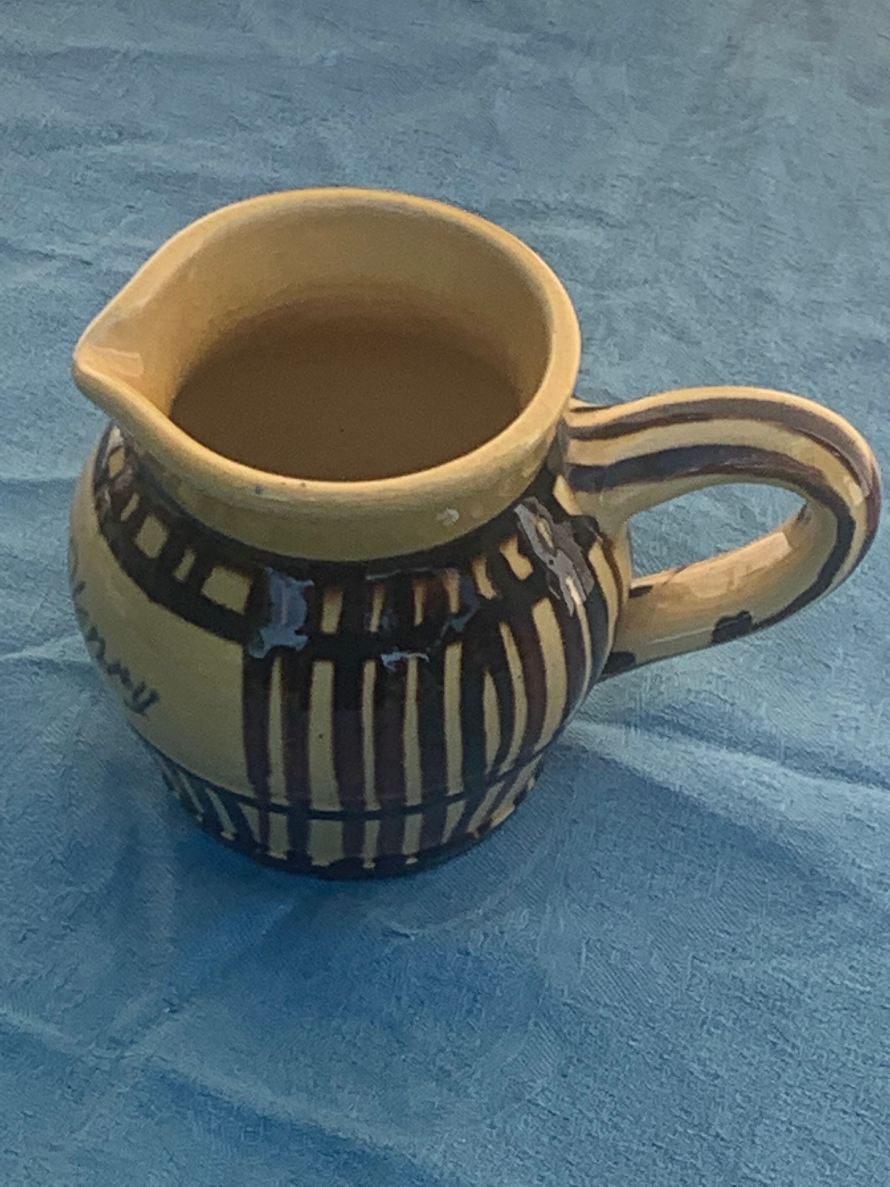 Vintage prince henry enamelled ceramic pitcher