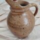 Old farm jug in glazed stoneware