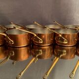 Suite of 12 tinned copper pans