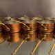 Suite of 12 tinned copper pans