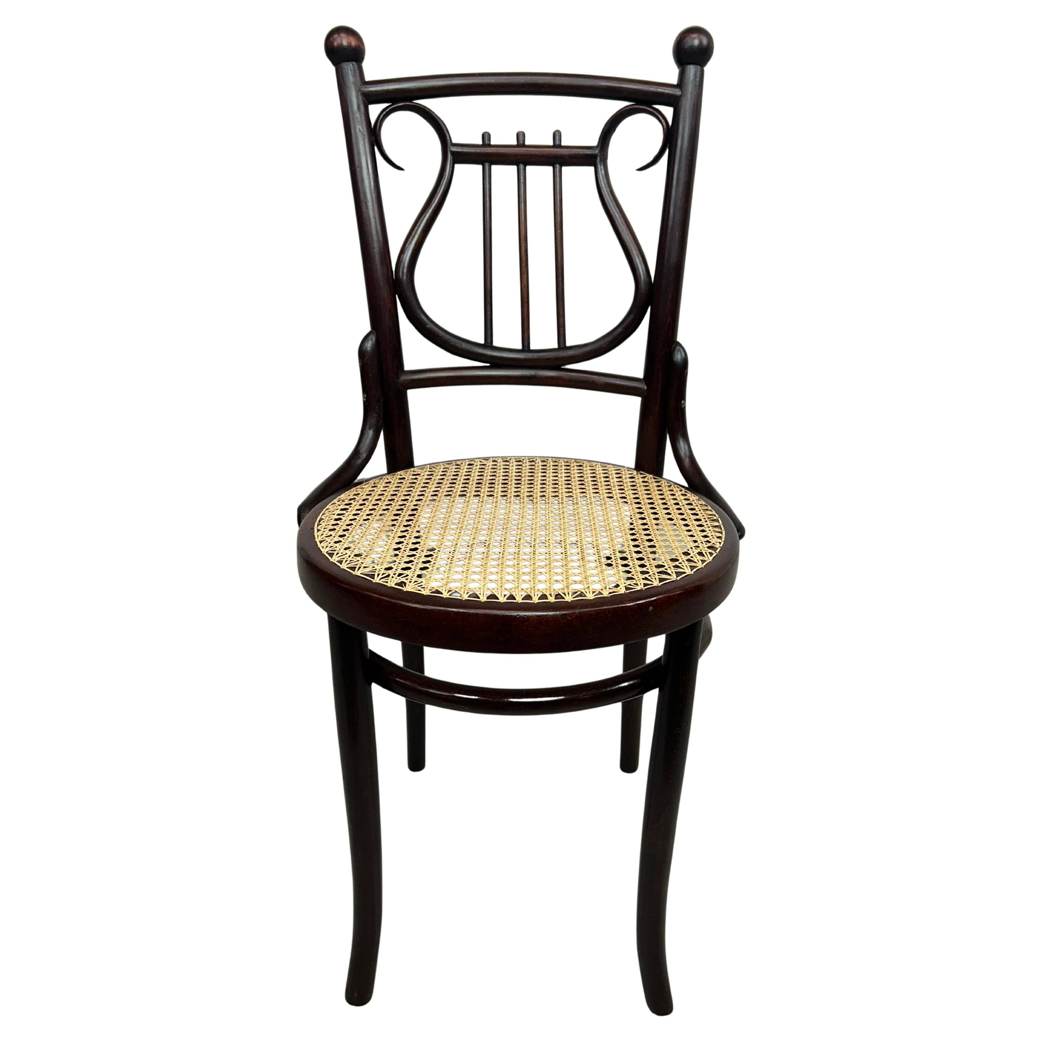 Curved wooden chair attributed to Thonet.