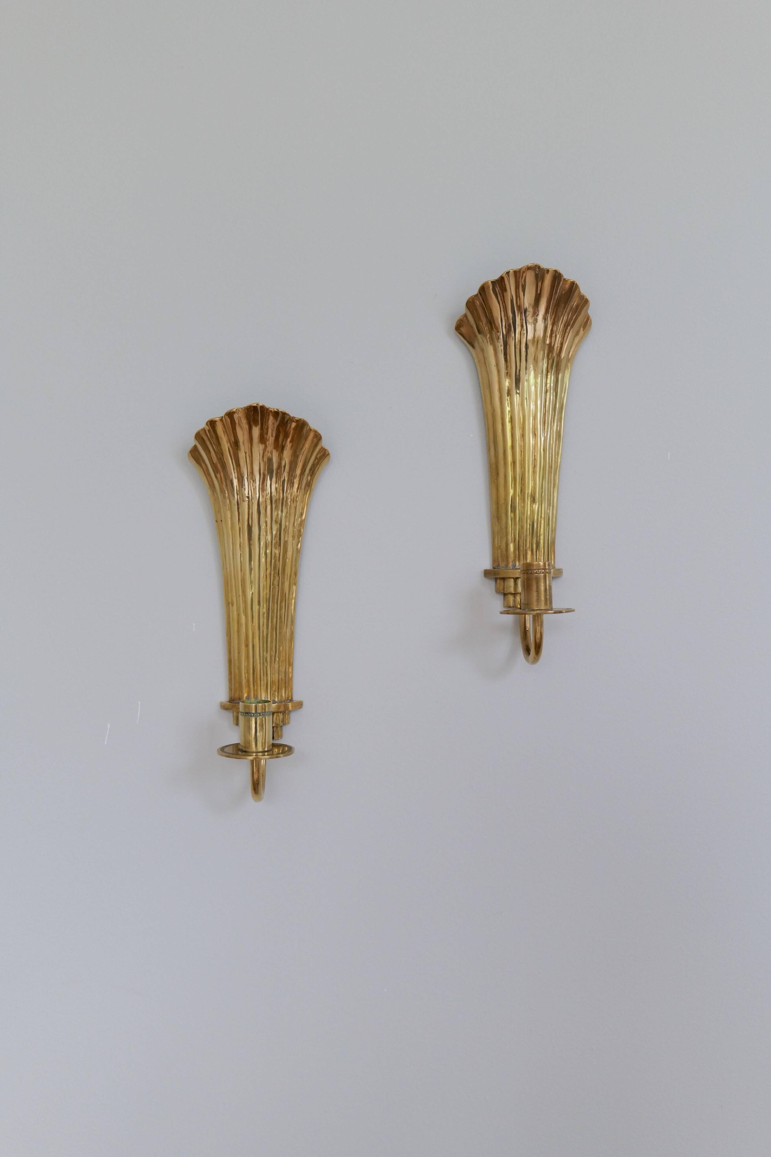 Pair of Art Deco brass wall sconces by Holmström, Arvika, Sweden, 1940s.