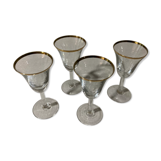 4 glasses with aperitif with golden border in blown glass