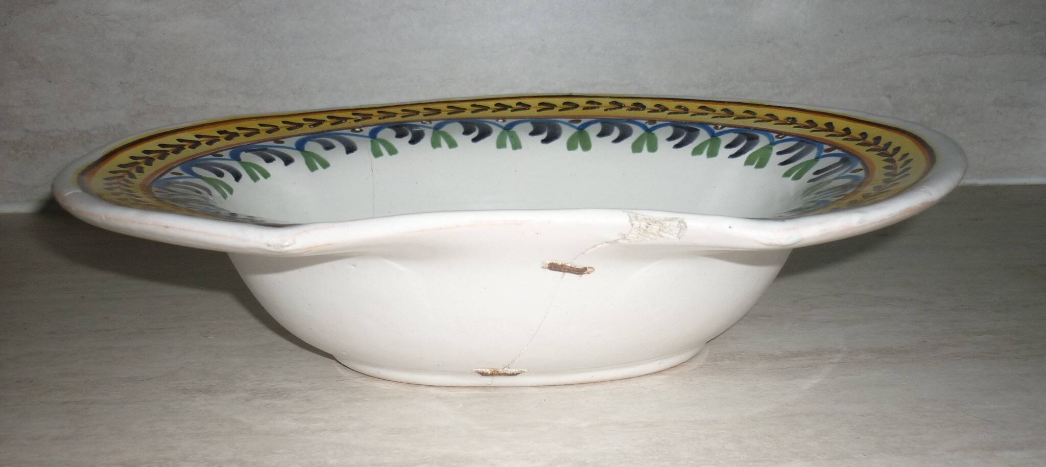 Old beard dish repair with staples