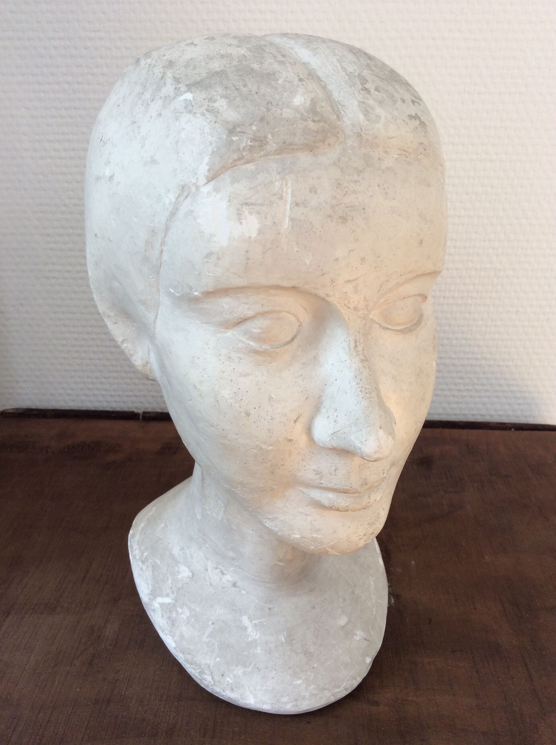 Plaster young woman at the bun