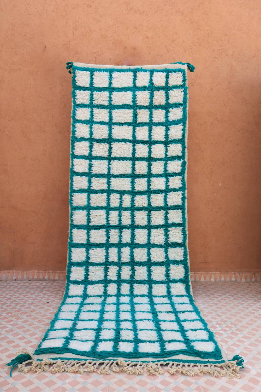 Moroccan hallway rug with inverted pine green and white checkerboard