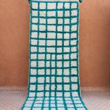 Moroccan hallway rug with inverted pine green and white checkerboard