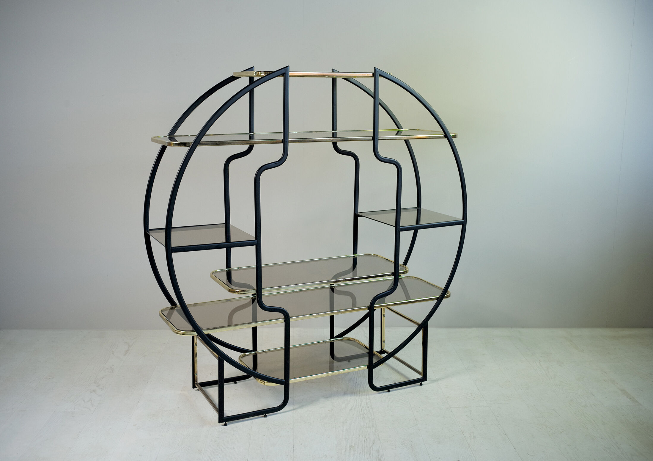 "Circle" library in black anodized metal and golden brass, 1970