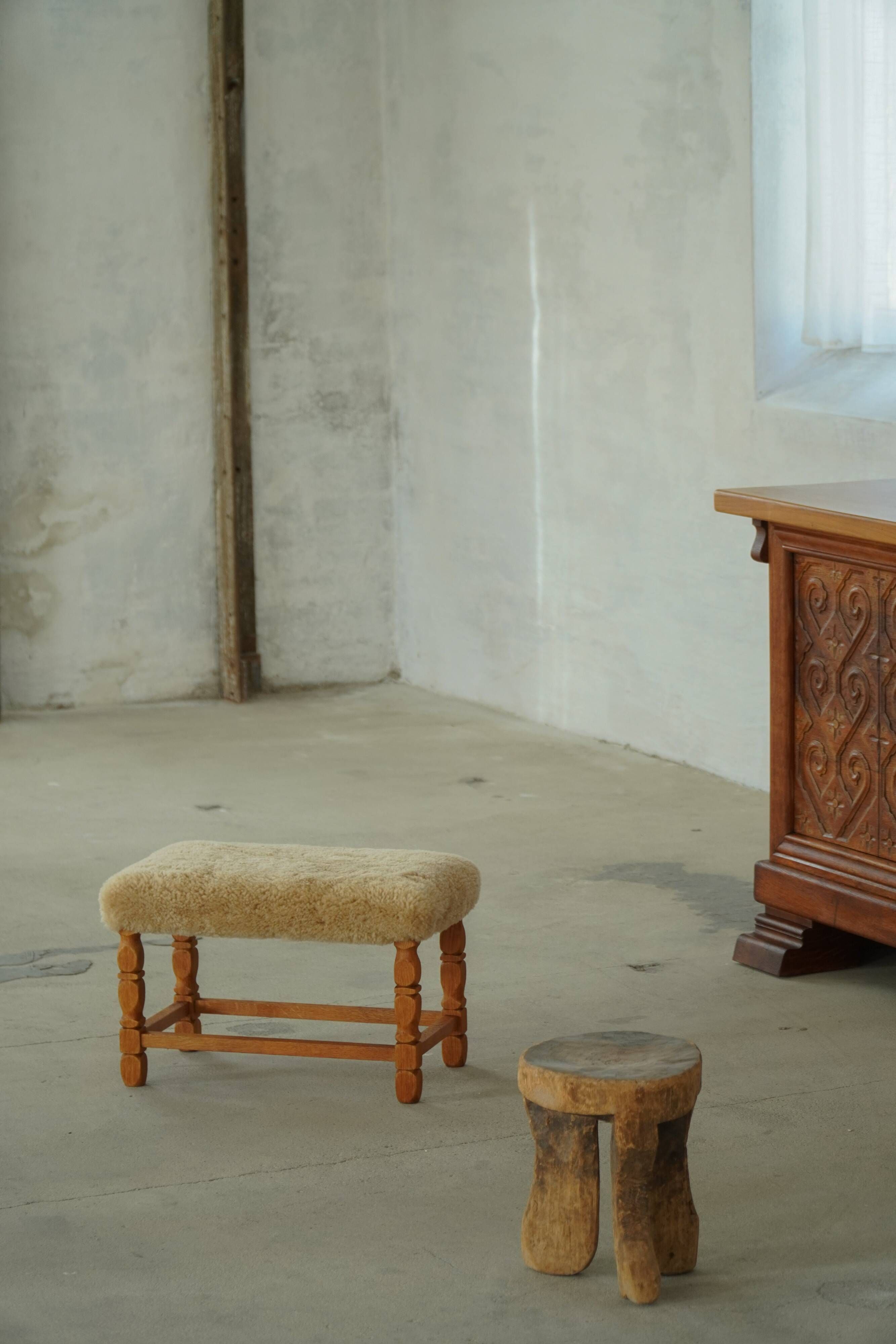 Rectangular oak stool, reupholstered in lambswool, Danish cabinetmaker, 1960.