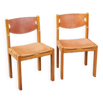 Pair of brutalist chairs in elm and stretched leather with saddle stitching Self publisher