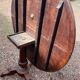 Old and large round winegrower's table made of wood.