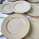 9 mid-century beige Tulowice stoneware plates