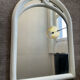 Vintage Art Deco style mirror in stained white wood.