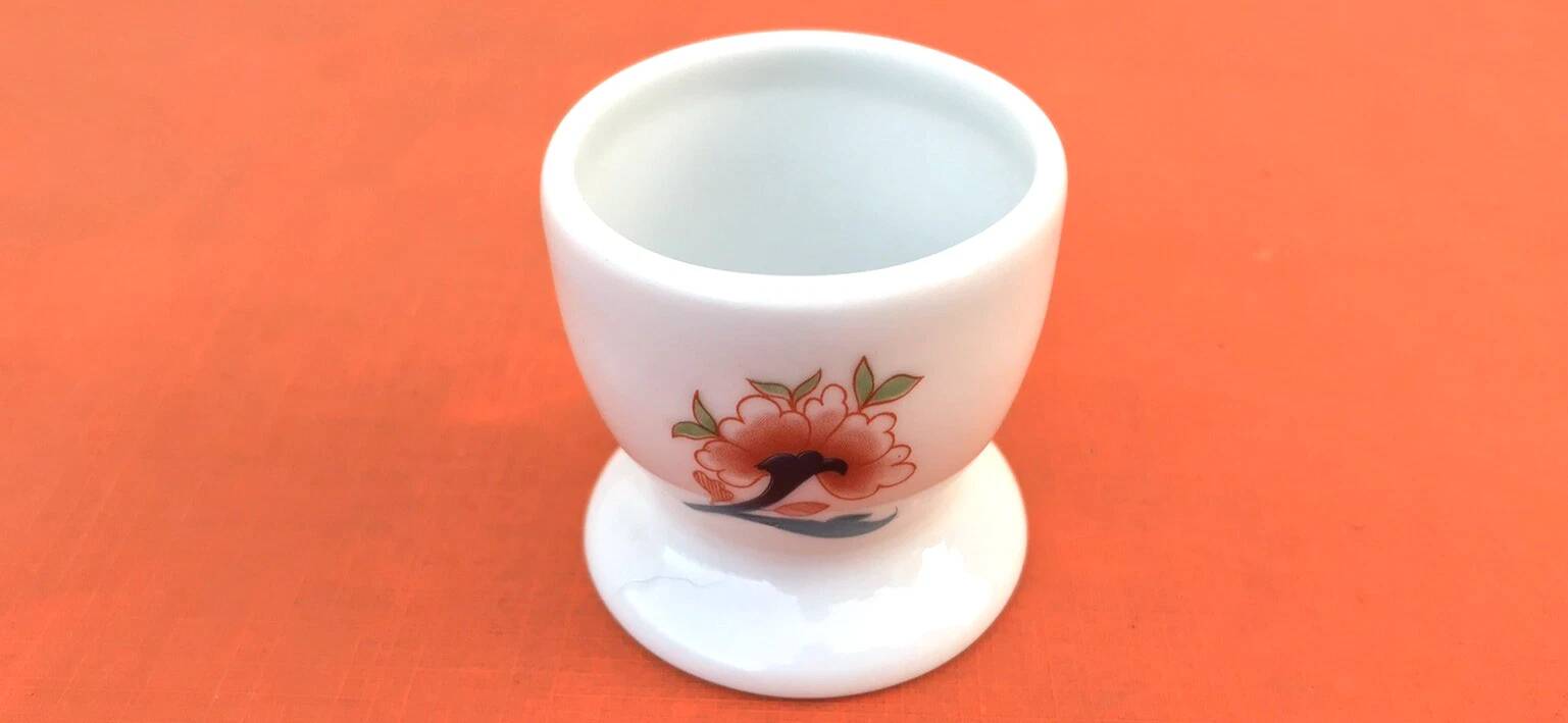 Ulysse Paris porcelain egg cup for Chanill with floral decoration.