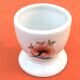 Ulysse Paris porcelain egg cup for Chanill with floral decoration.