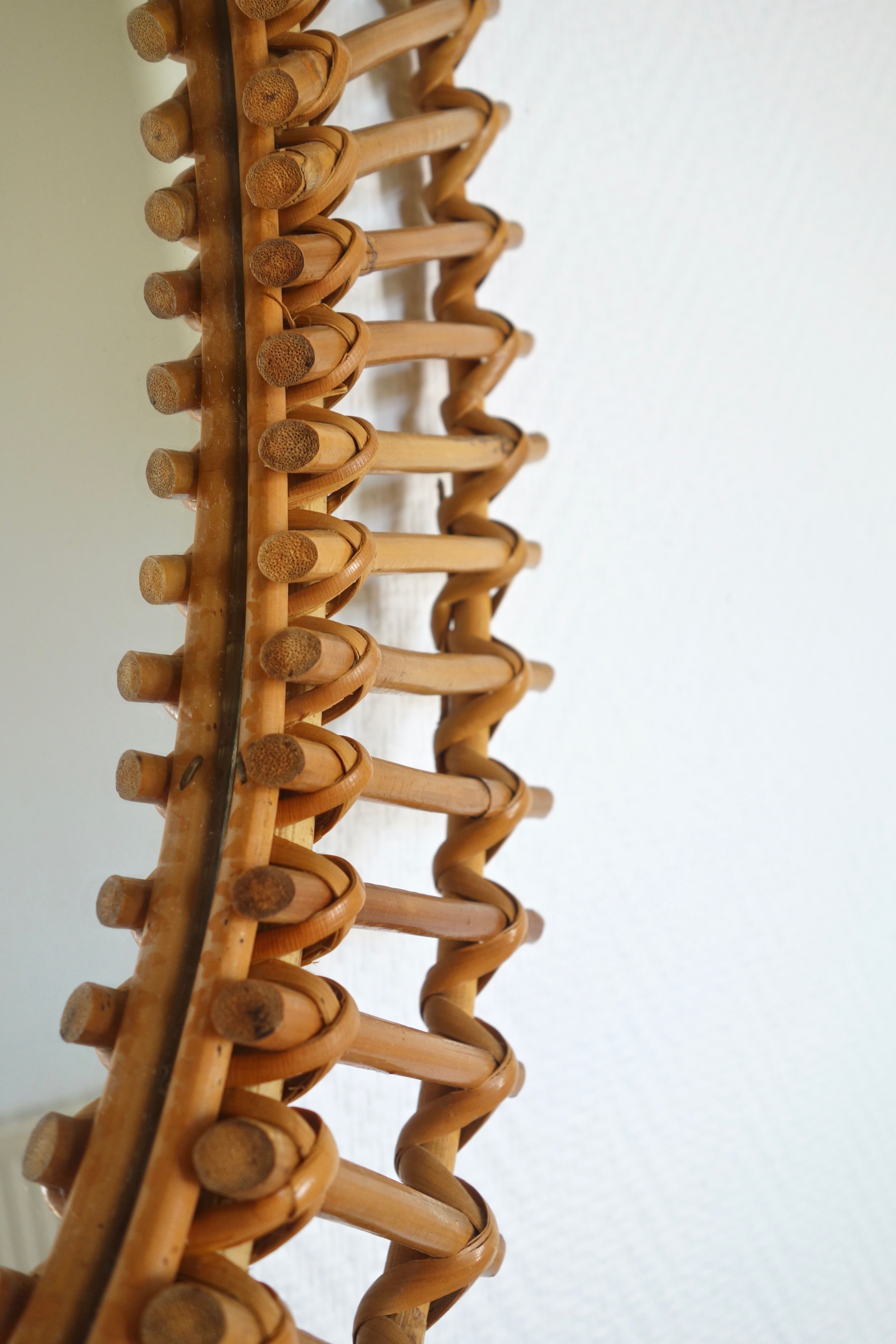 Free-form sun mirror in 60s rattan