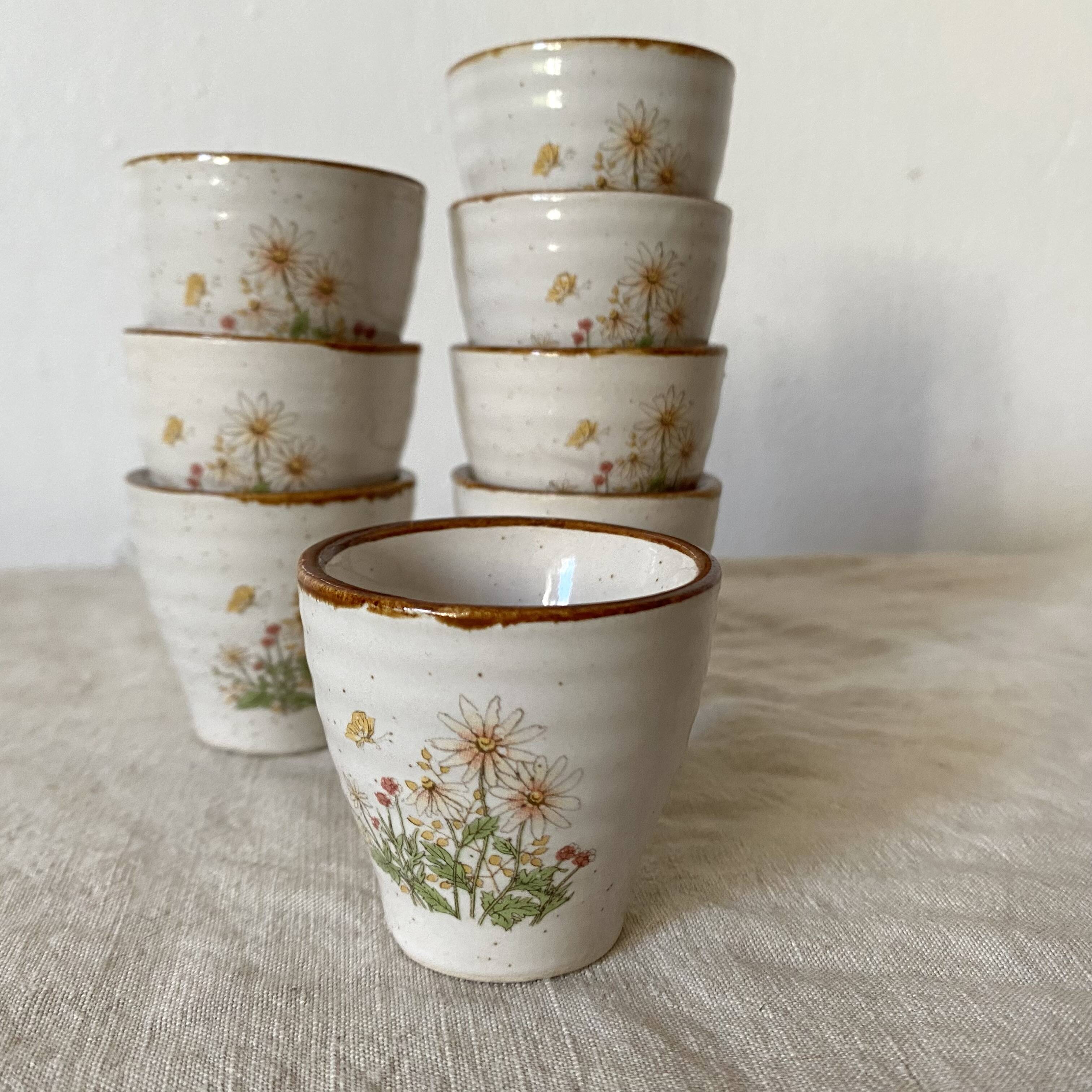 Stoneware egg cups, floral decoration