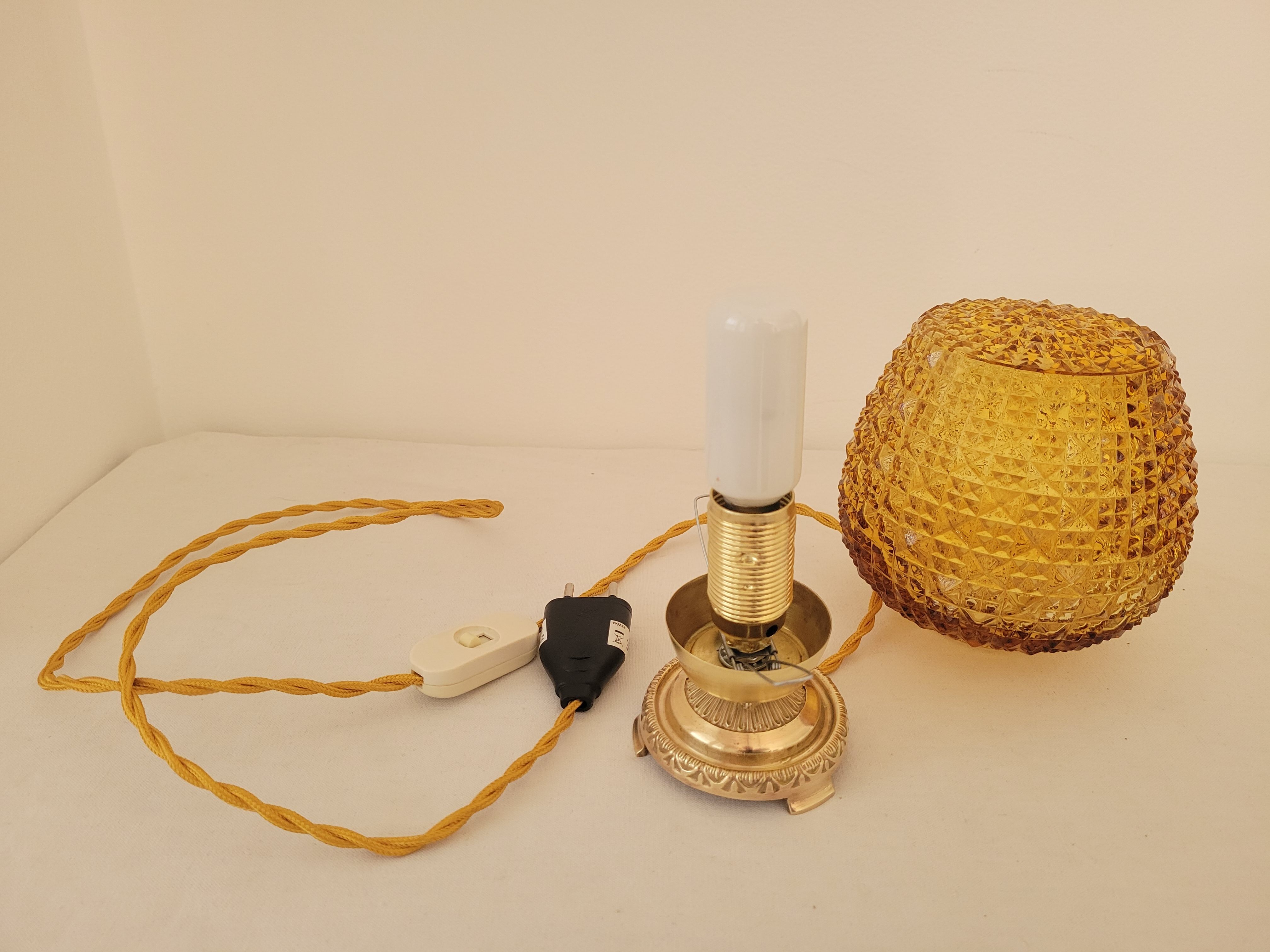 Bedside lamp in amber glass and brass