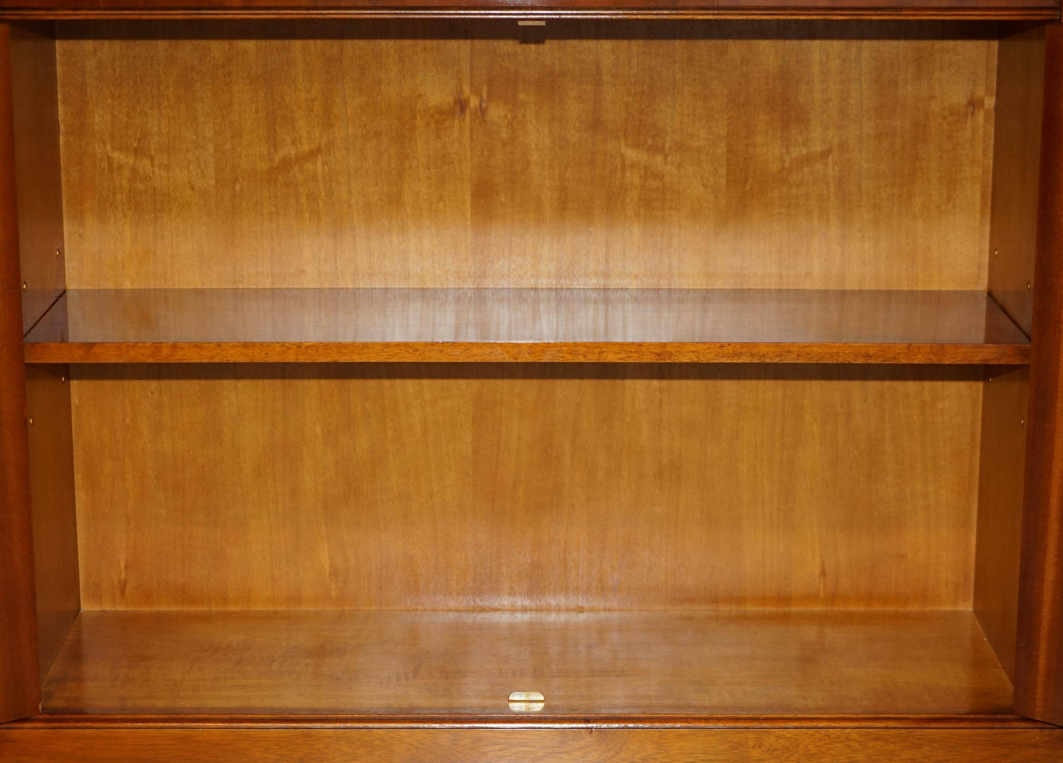 Open library Bradley Furniture made of yew wood with a cupboard base.