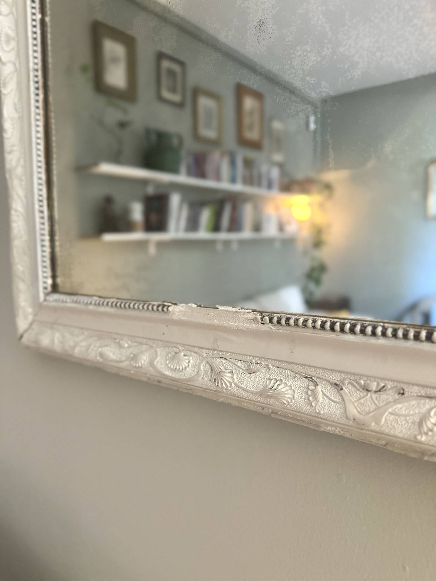 Antique Louis-Philippe mirror with pearls and shells, white patina.