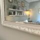 Antique Louis-Philippe mirror with pearls and shells, white patina.
