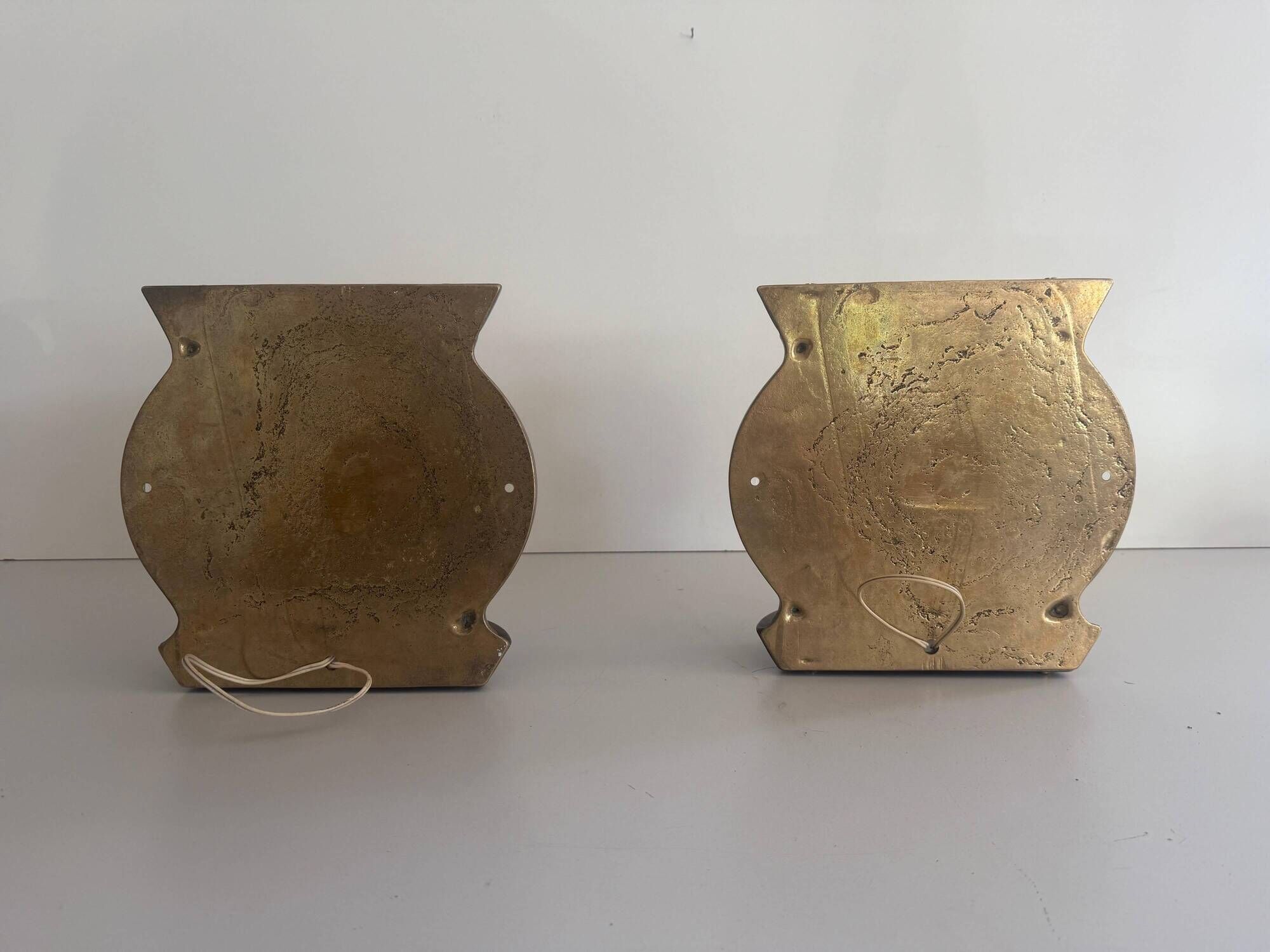 Pair of bronze and glass wall lights from the mid-century, 1960, Italy.