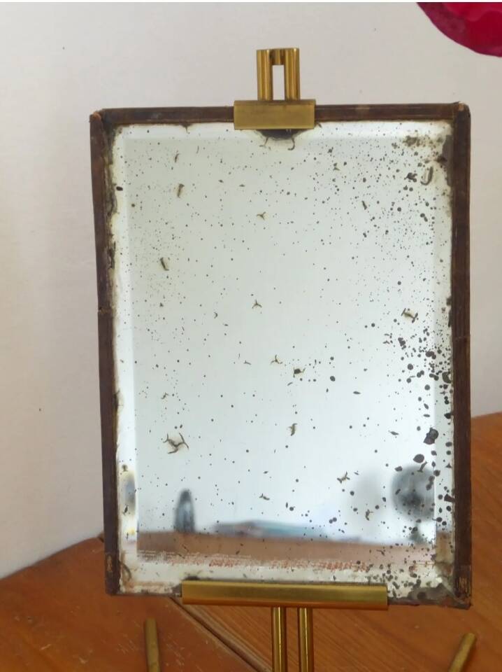Table mirror on a brass easel