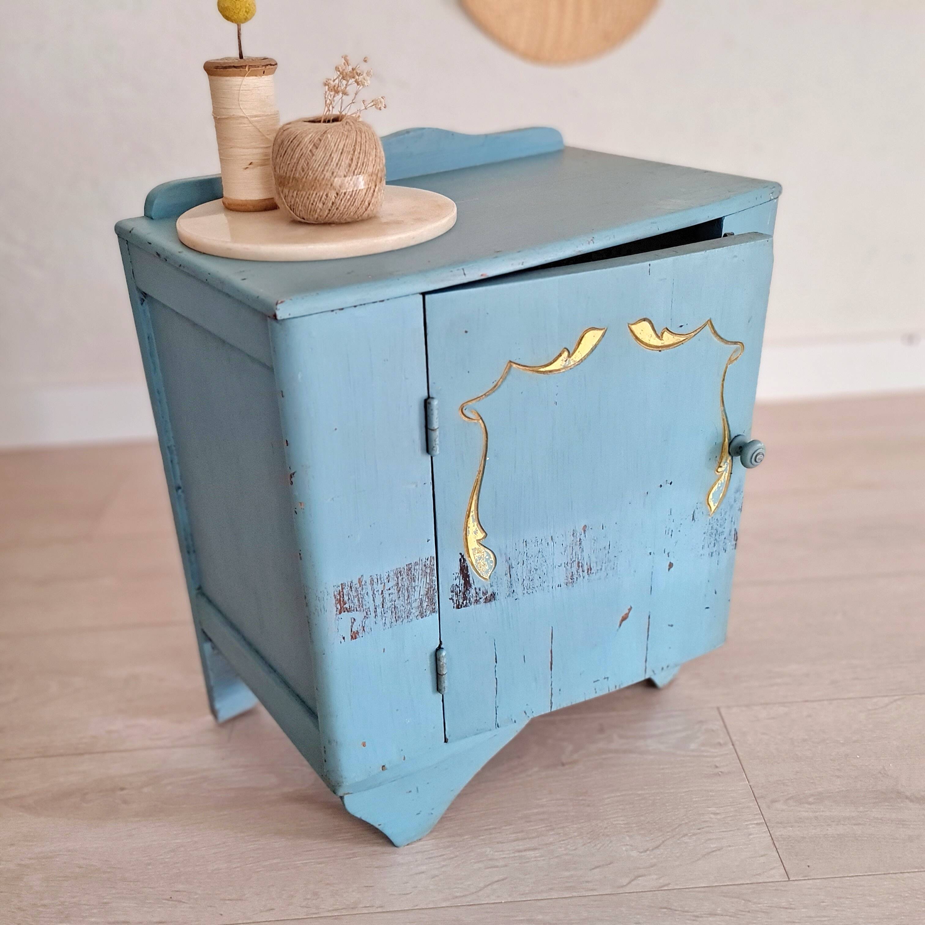 Old blue wood bedside table