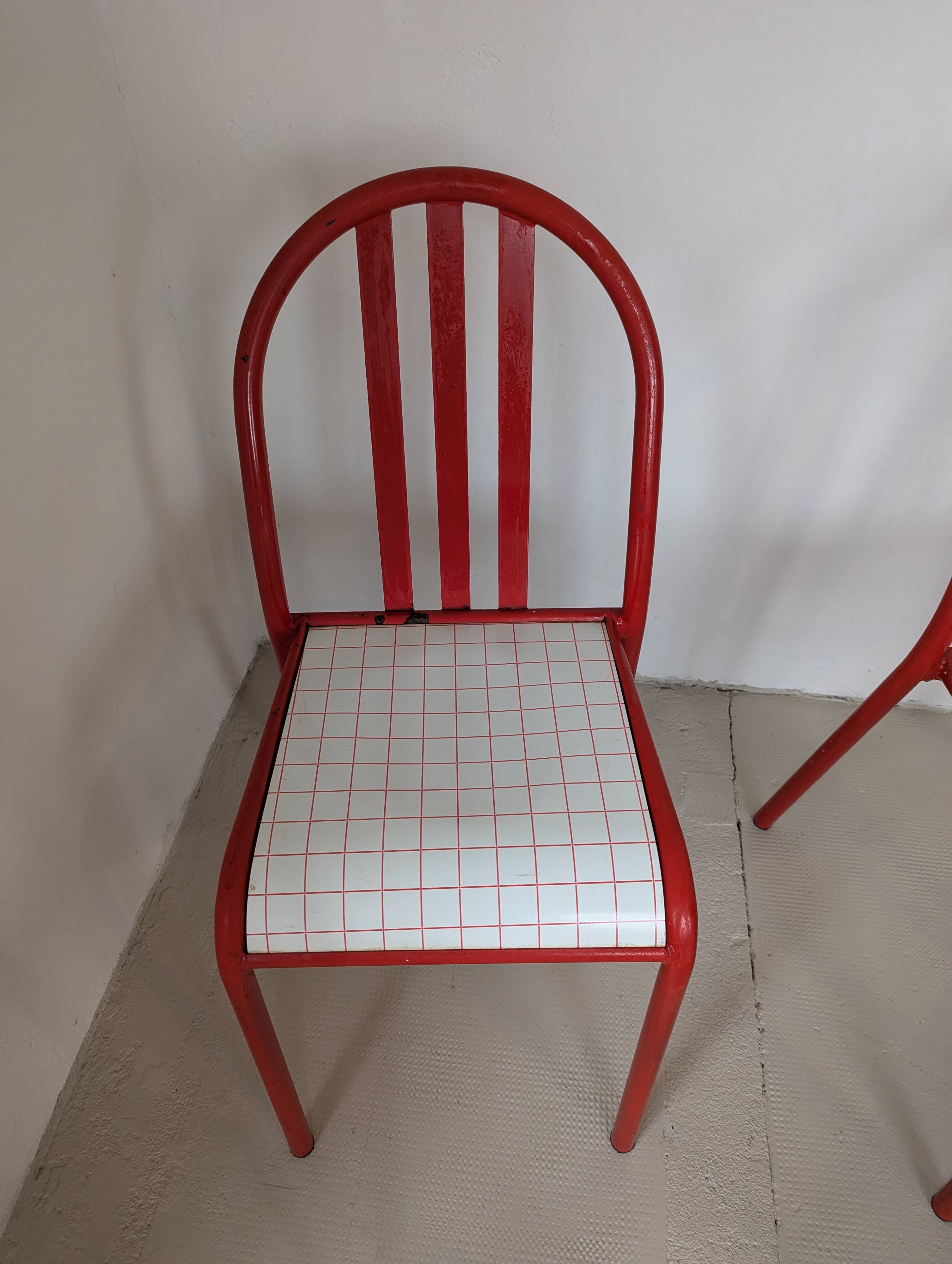 Set of 4 modernist red metal chairs