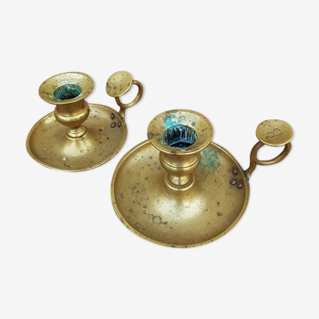 Old pair of brass candlesticks cellar rats