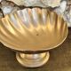 Large brass shell-shaped pocket emptier