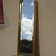 Vertical mirror, gold frame with beading.