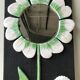 Ceramic flower mirror.