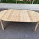 Scandinavian round extendable dining table stripped in solid wood from the 1970s.