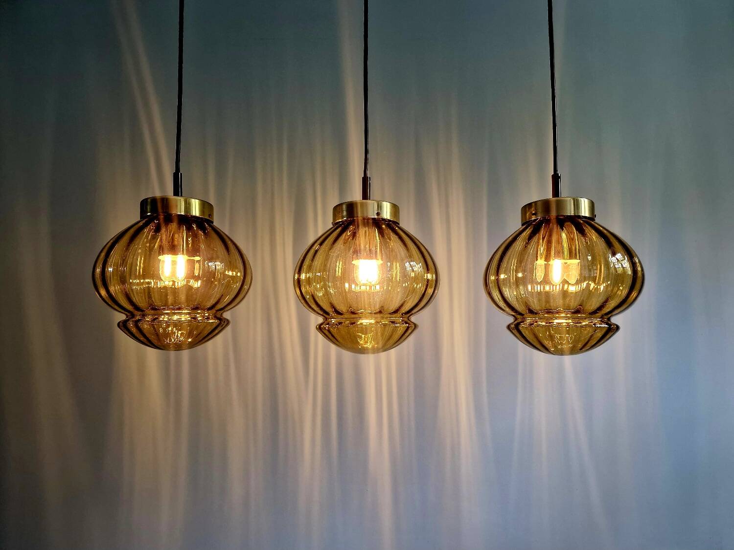 Set of 3 amber glass pendant lights, RAAK Amsterdam, 1970