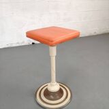 Old swivel orange sitting dentist stool