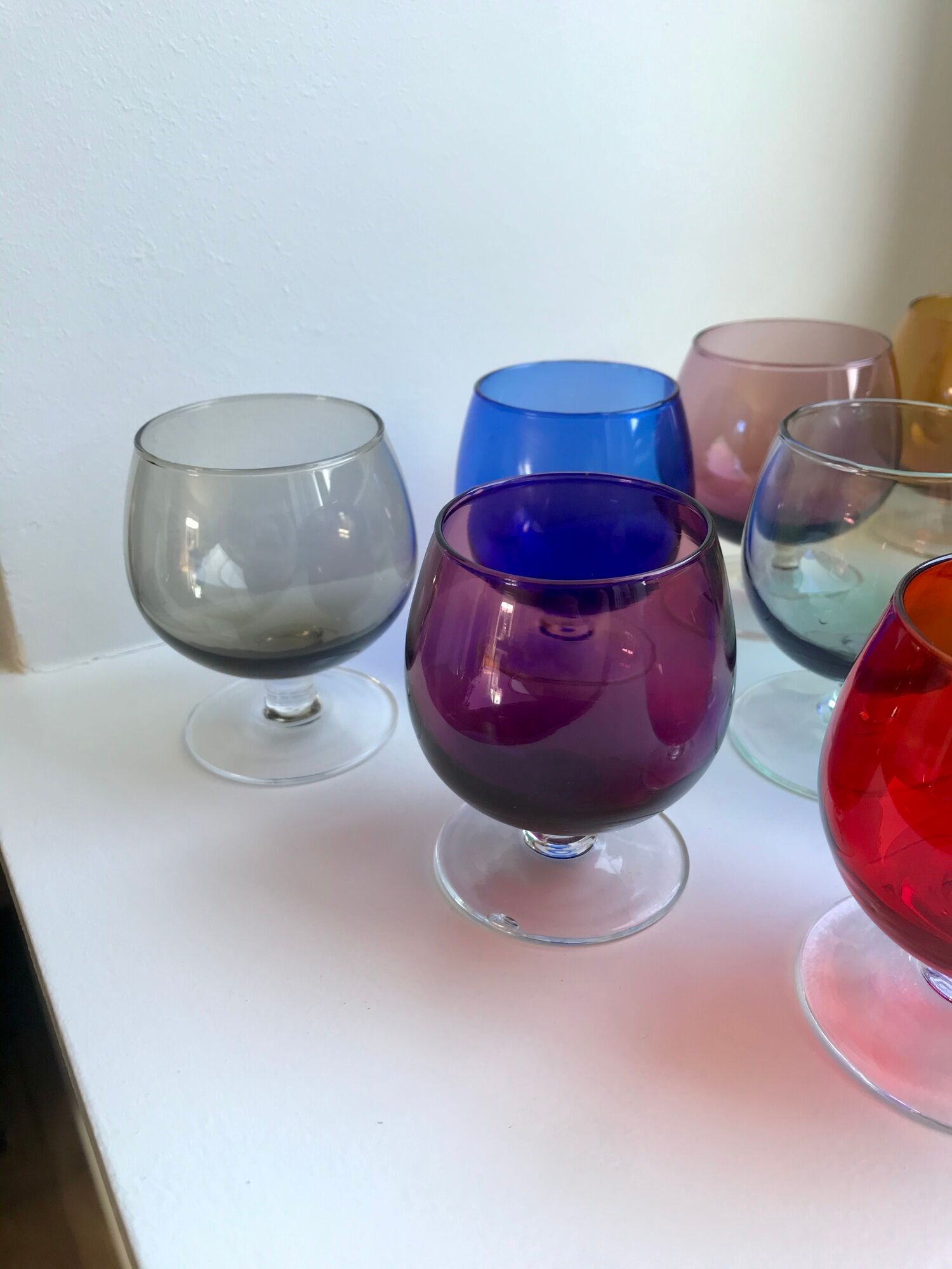 Set of 9 glasses with colored feet in blown glass 50s