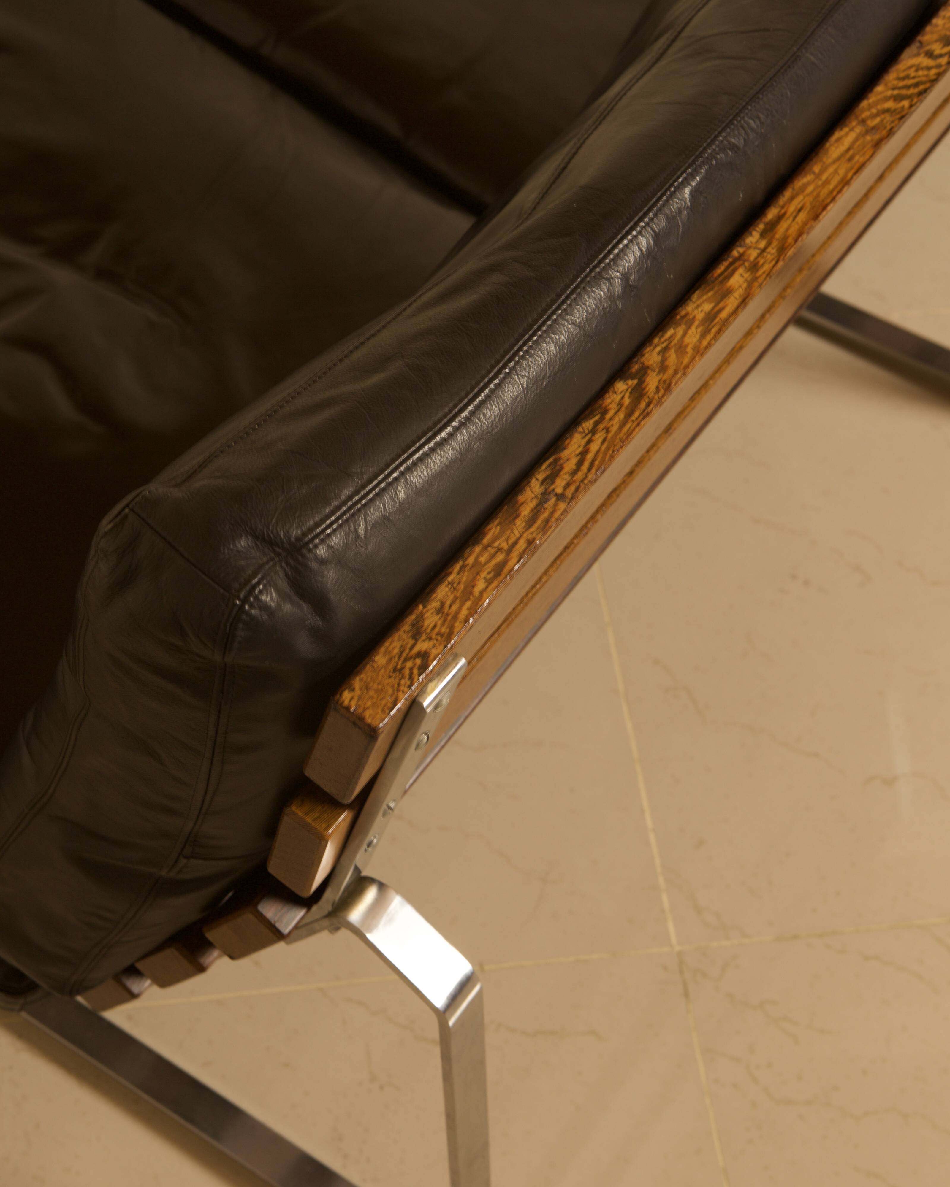 Unique Dutch bench in black leather with a steel and wenge structure from the 60s.