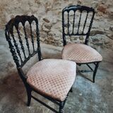 Pair of antique Napoleon III chairs in blackened wood and fabric