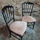 Pair of antique Napoleon III chairs in blackened wood and fabric.