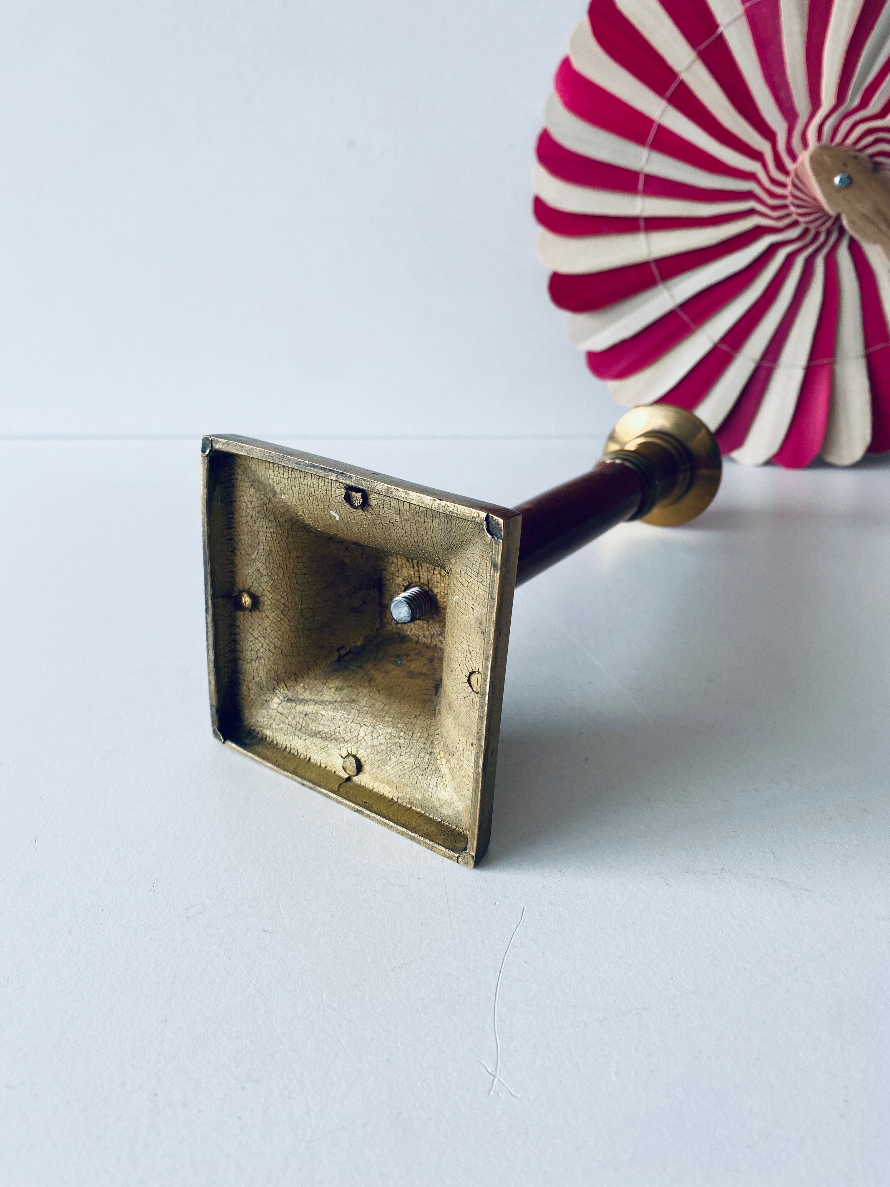 Old candle holder in brass and wood