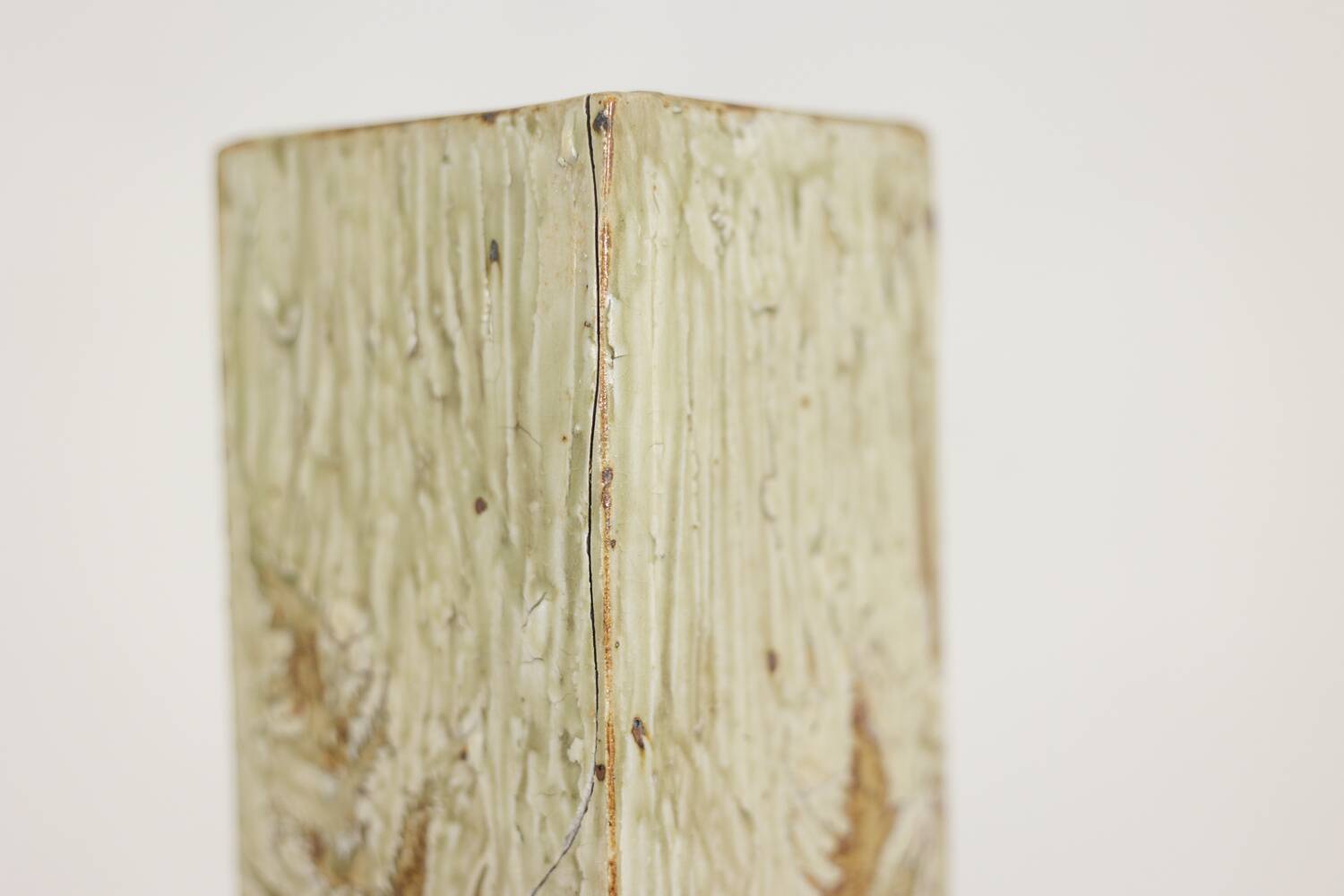 Brutalist stoneware vase with a plant motif. 1970s.