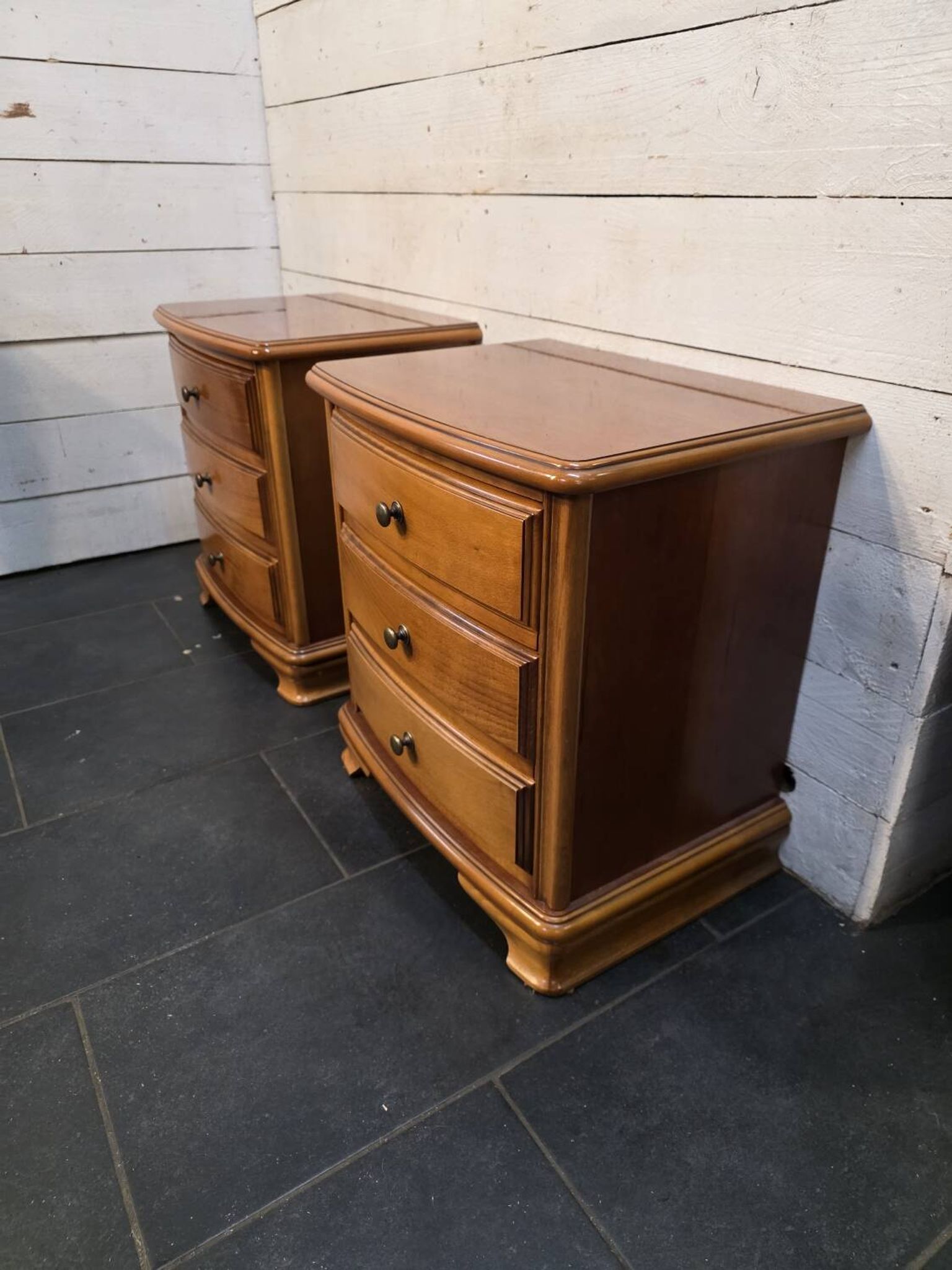 Pair of Louis Philippe style bedside tables in cherry wood.