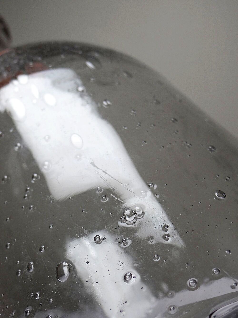 Large antique blown glass bottle with bubbles, early 20th century 1900-1920.