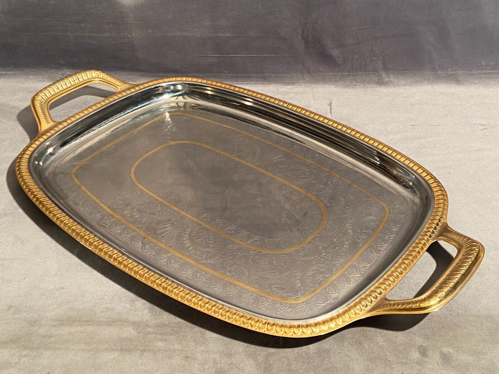 Top with stainless steel handles and gilded Regency style nets